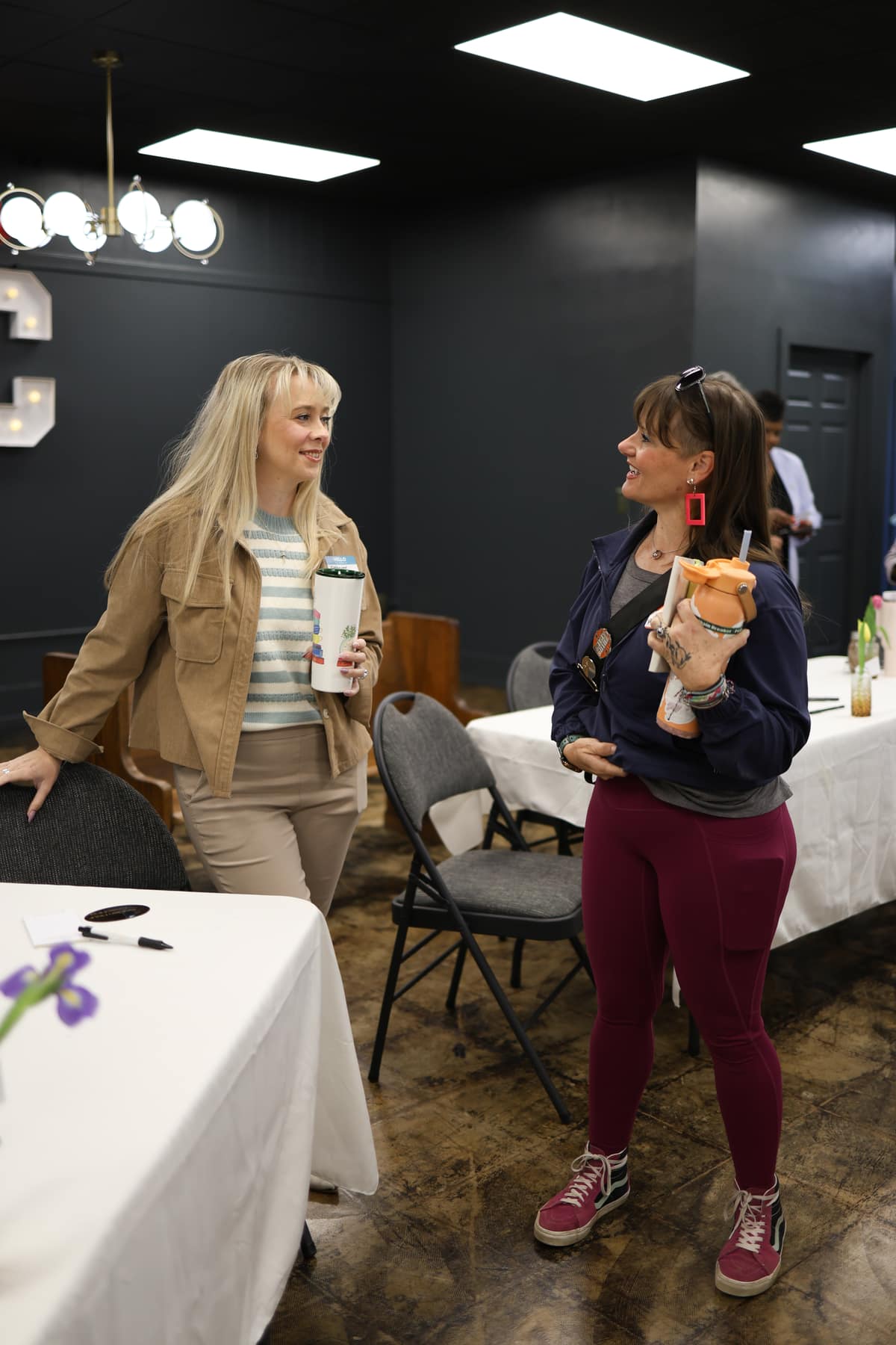 Two women connecting over coffee at the breakfast